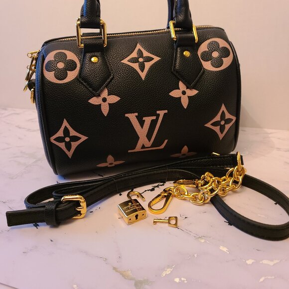 "Black Leather Designer Handbag with Beige Motifs & Gold Accents" - Picture 1 of 9